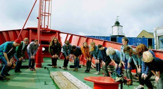 The choir doing their stretches before the recording session