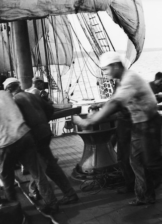 Crew at the capstan, weighing anchor