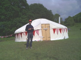 Ed Hicks outside the first Trad Academy workshop yurt at FiTM 2012
